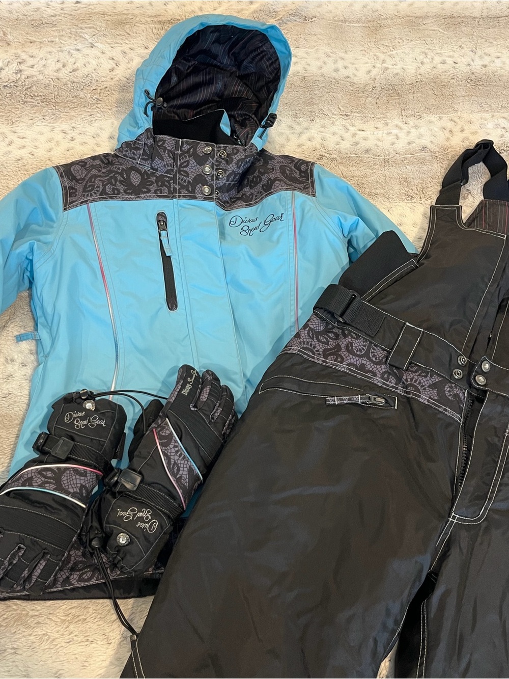 Diva Snow Gear Light Blue and Black Ski Jacket with Black Bib Pants and Gloves